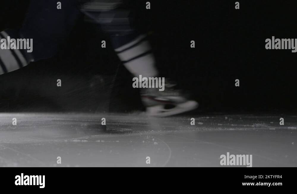 Ice hockey player shoots the puck, power slap shot in canadian style by