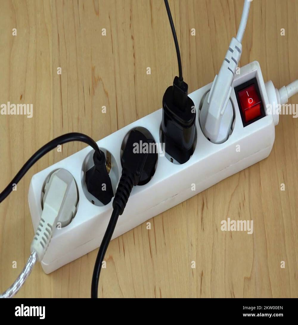 woman hands turn on electricity extension switch with many plugs Stock Video Footage Alamy