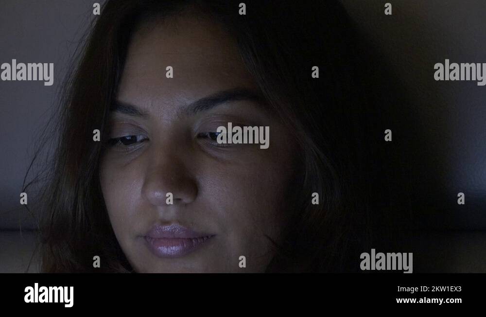 Close up woman face artificial light by mobile phone fast eyes moving