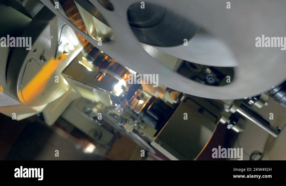 Working mechanism of an old vintage film projector. Dolly shot Stock