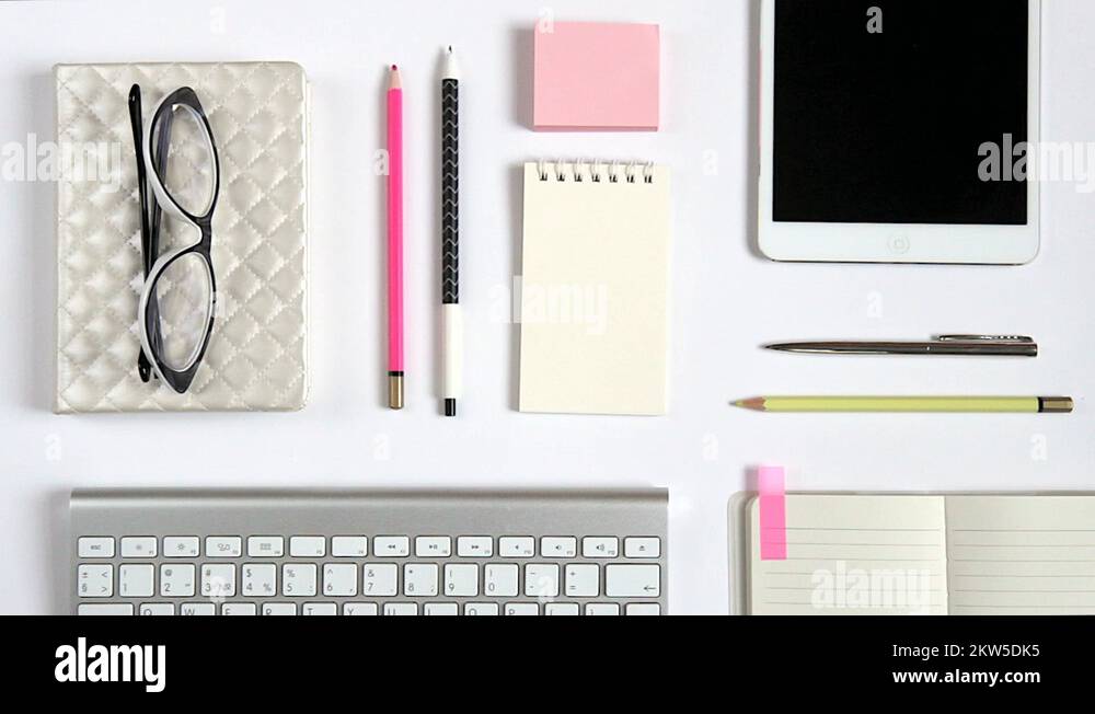 Tablet Workspace Layouts Beautiful layout of workspace with tablet, keyboard and few pink items ...