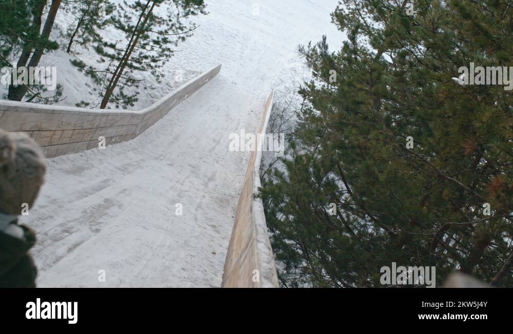 Kid Sliding Down Icy Hill Stock Video Footage Alamy