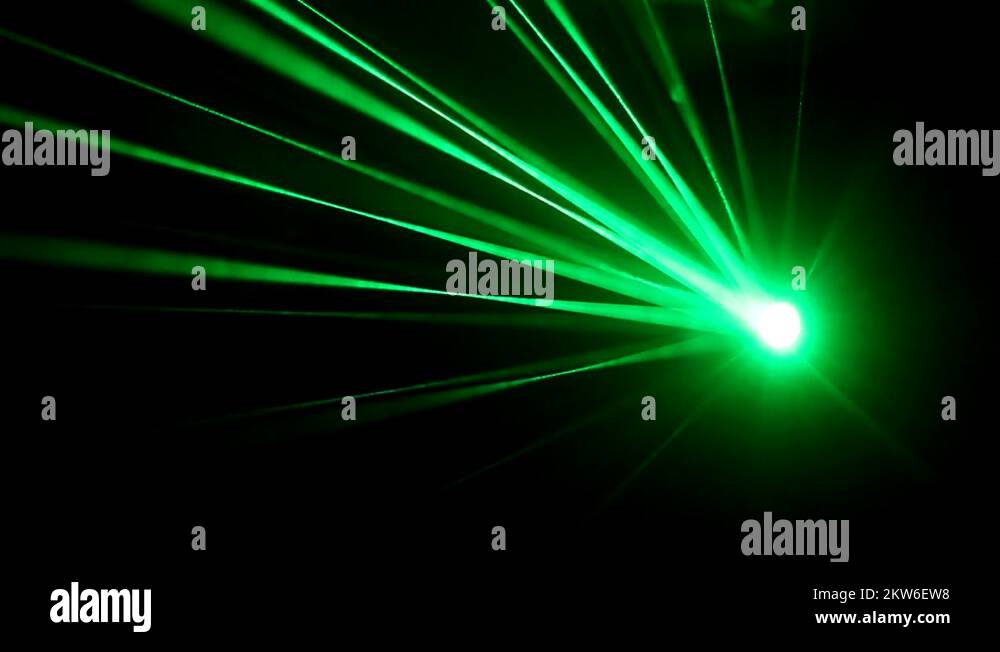 Laser lights on the dance floor in a strobe light shines