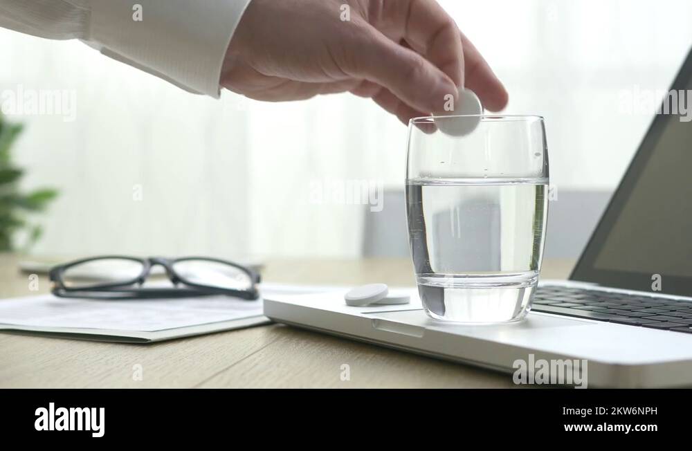 Effervescent tablet dissolving into water Stock Video Footage Alamy