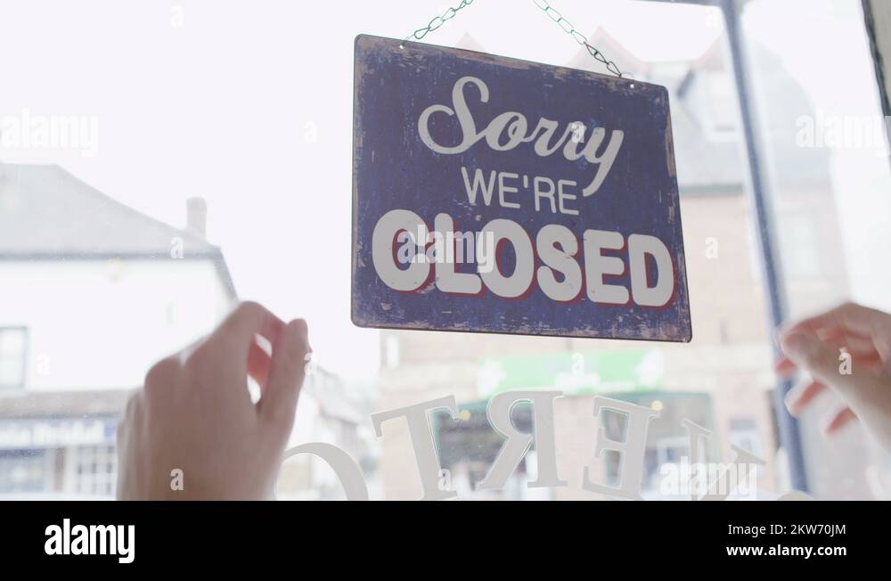 4K 'Closed' sign is turned to 'Open' in a storefront window Stock Video ...