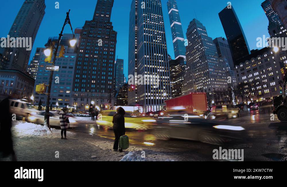 New York City People cross wet snowy streets after winter storm time ...