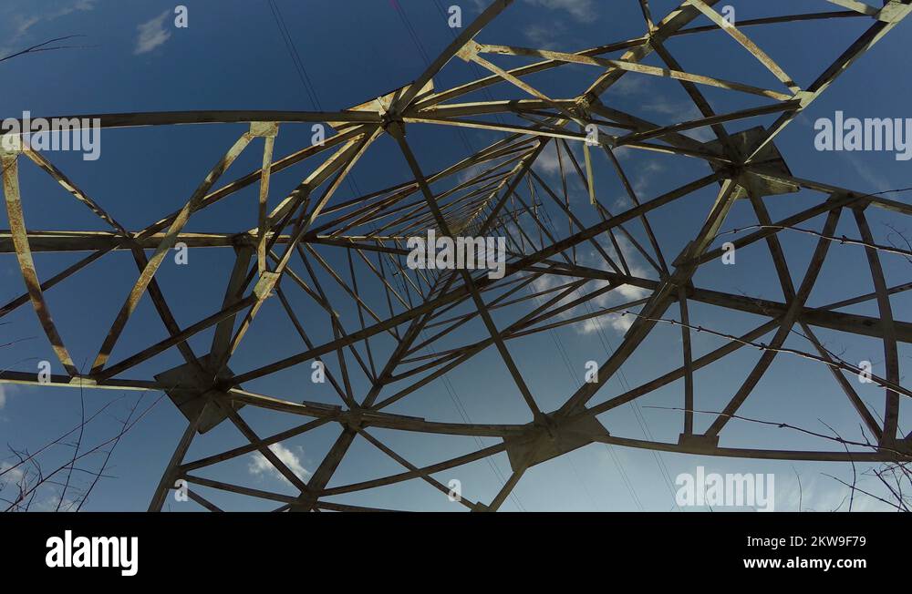 High voltage electrical pylon construction from beneath and camera