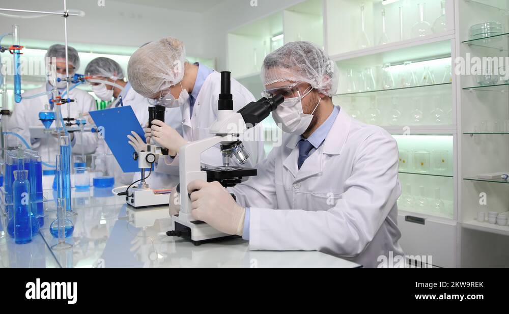 Researcher People Team Work Analyze Bacteria on Microscope Healthcare