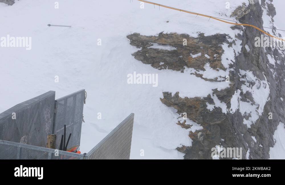 4k footage of View at the mount Titlis peak in foggy misty weather