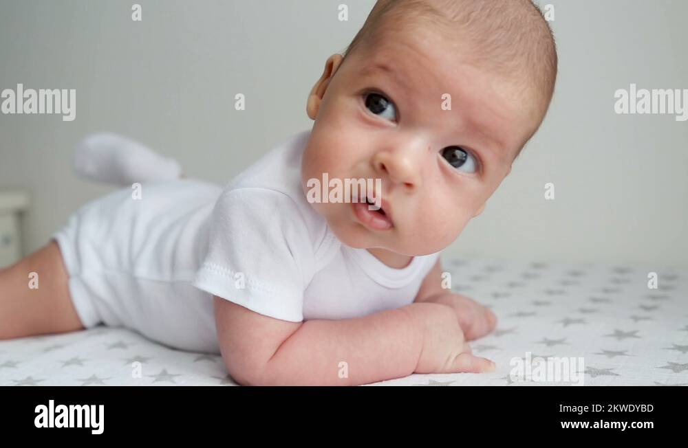 newborn lies on the stomach on a diaper Stock Video Footage Alamy