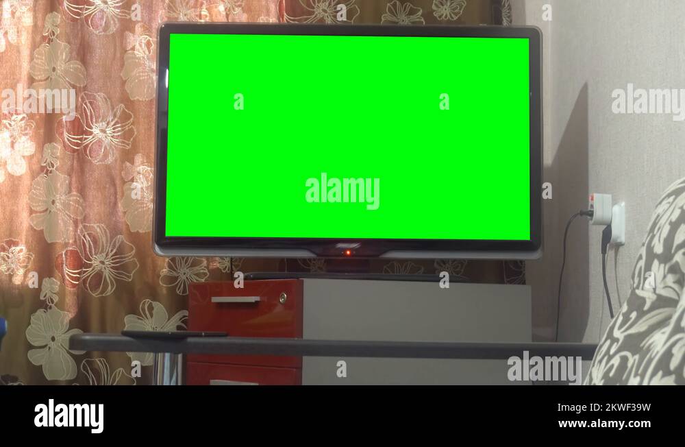 Dolly Move Into A Big Screen TV With Greenscreen Stock Video Footage dolly-move-into-a-big-screen-tv-with-greenscreen-stock-video-footage