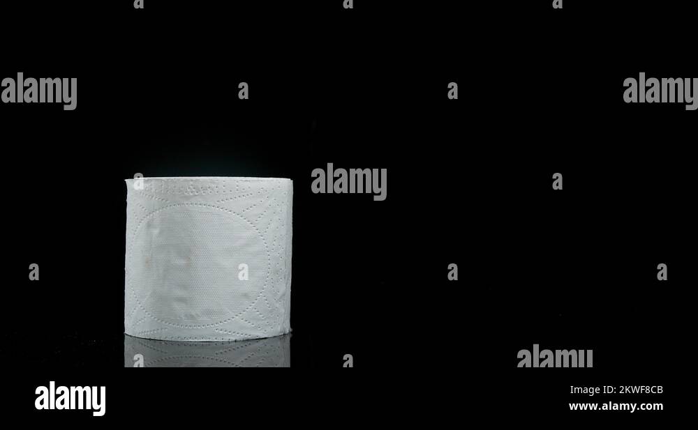 Roll of Toilet Paper Falling on Black Background, Slow Motion 4K Stock