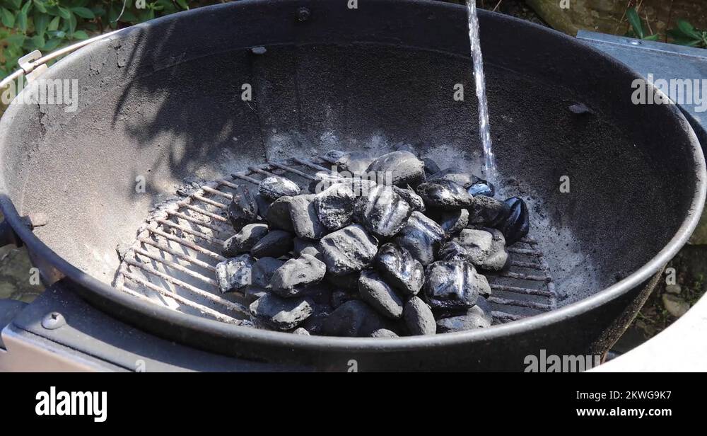 Starting BBQ with lighter fluid, 4k Stock Video Footage Alamy