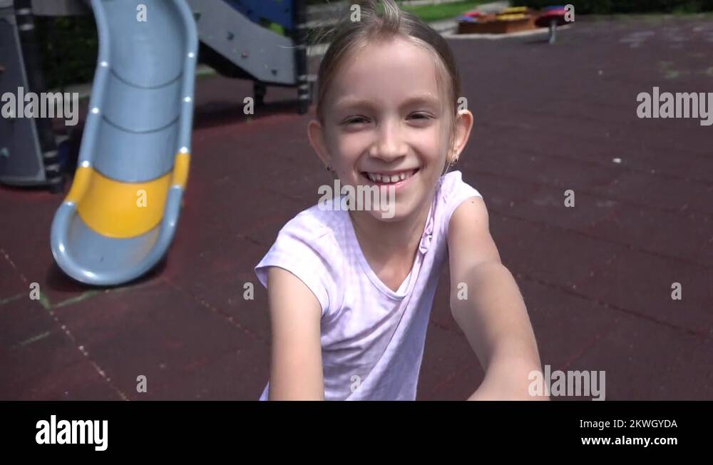 Child Running Spinning at Playground, Laughing Smiling Girl Portrait in