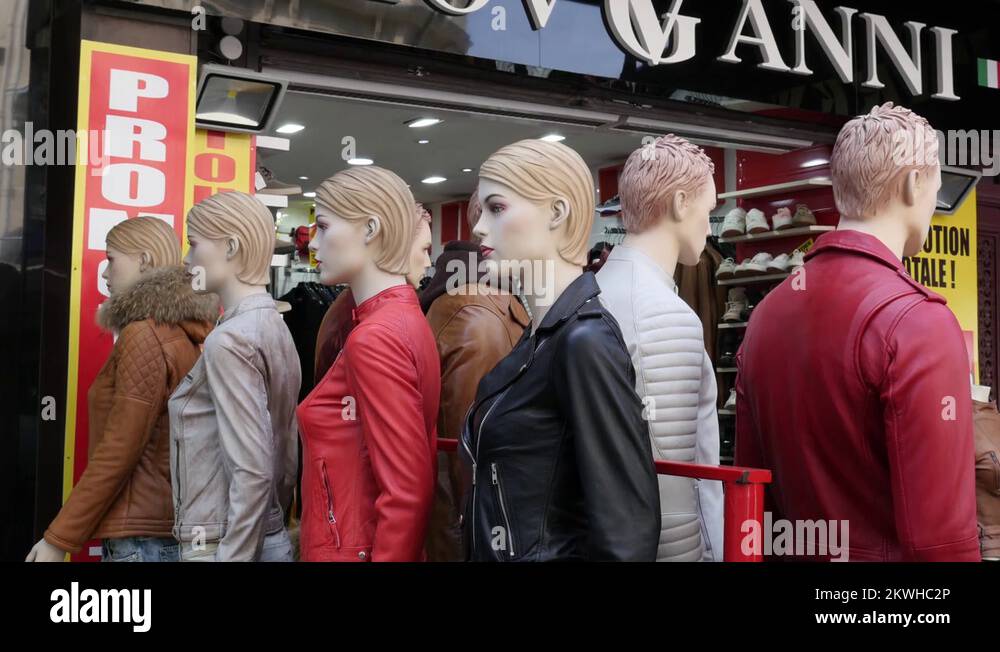 Mannequins in leather jackets clothes shop entrance on a street of