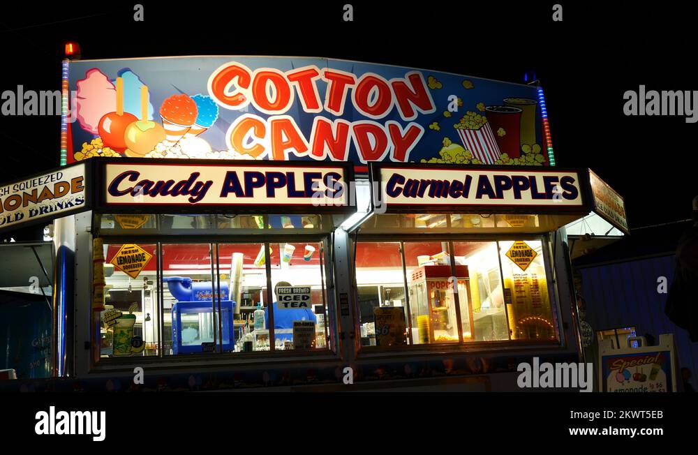 A Cotton Candy concession stand at a county fair at night Stock Video