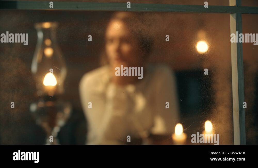 rack focus from window to frontier woman thinking Stock Video Footage