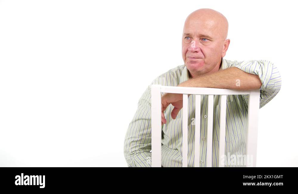 Man Sleeping on a Chair Wake Up Suddenly and Look Around Scared Stock