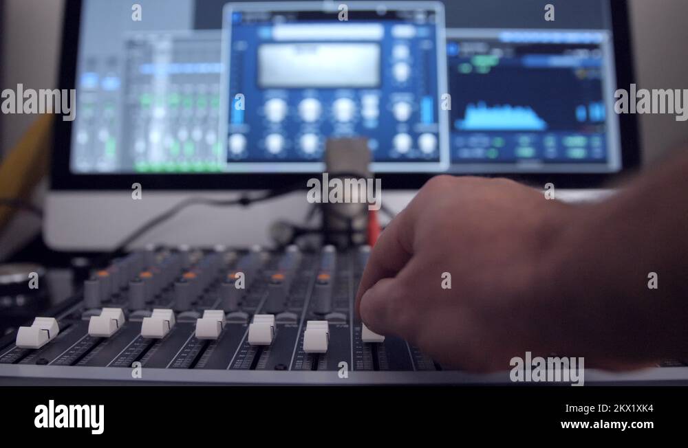 Mixing audio with an audio mixing board Stock Video Footage Alamy