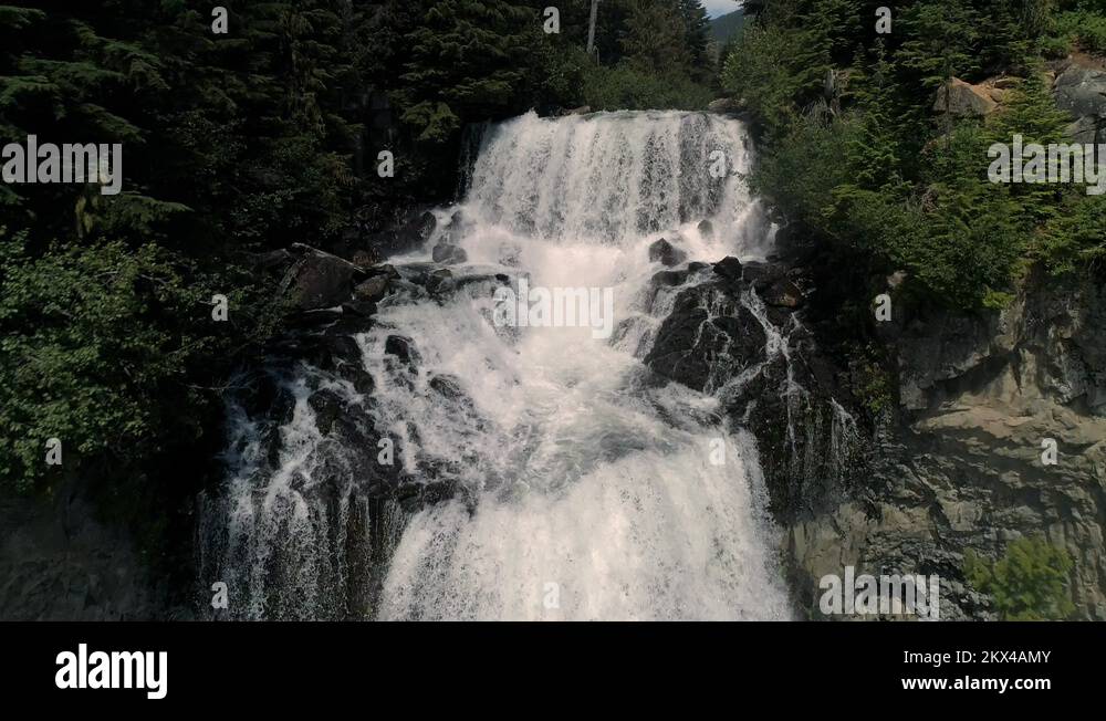 Spectacular Waterfall Aerial Flying Down Canyon Cliff with Water