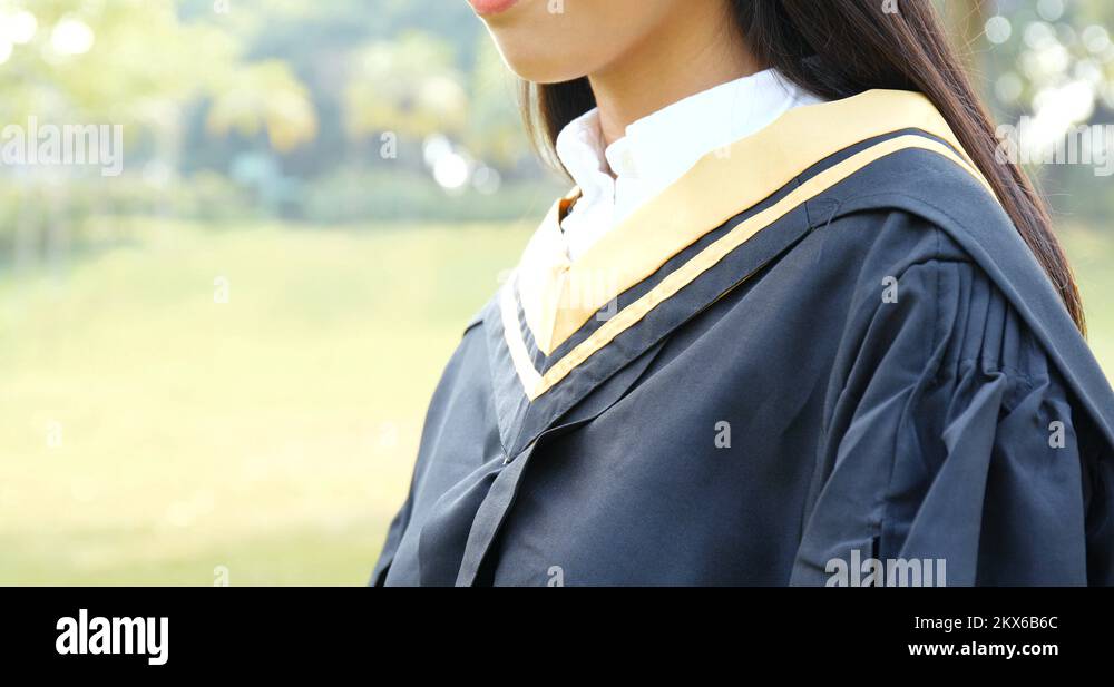 Body part of woman adjusting the graduation gown Stock Video Footage ...