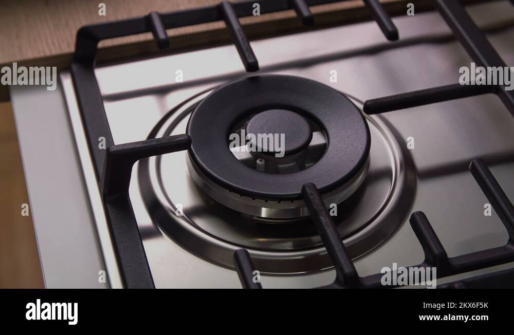 Turning gas on gas stove and putting on a wok Stock Video Footage Alamy