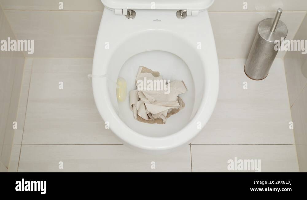 Flushing Toilet. Water Drained into the Toilet Bowl Stock Video Footage