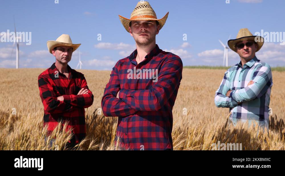 Farmers Team Posing Successful Worker Men in Wheat Field Bio Farming