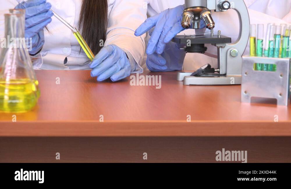 Close up researcher team hands in lab use pipette test tube pharmacy