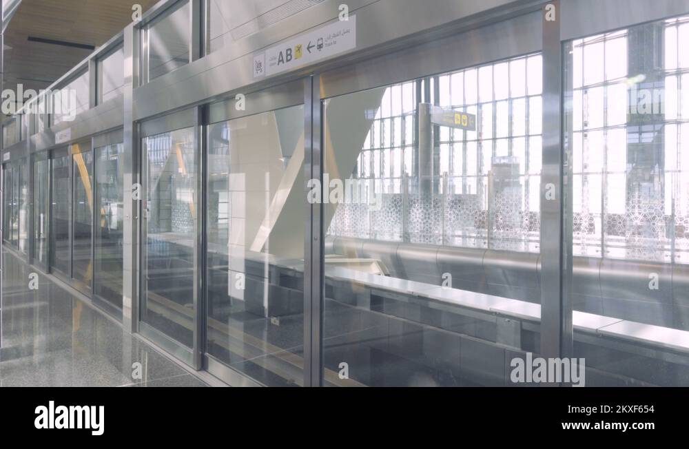 Doha, Qatar, Hamad International airport. Unmanned train arrives Stock ...