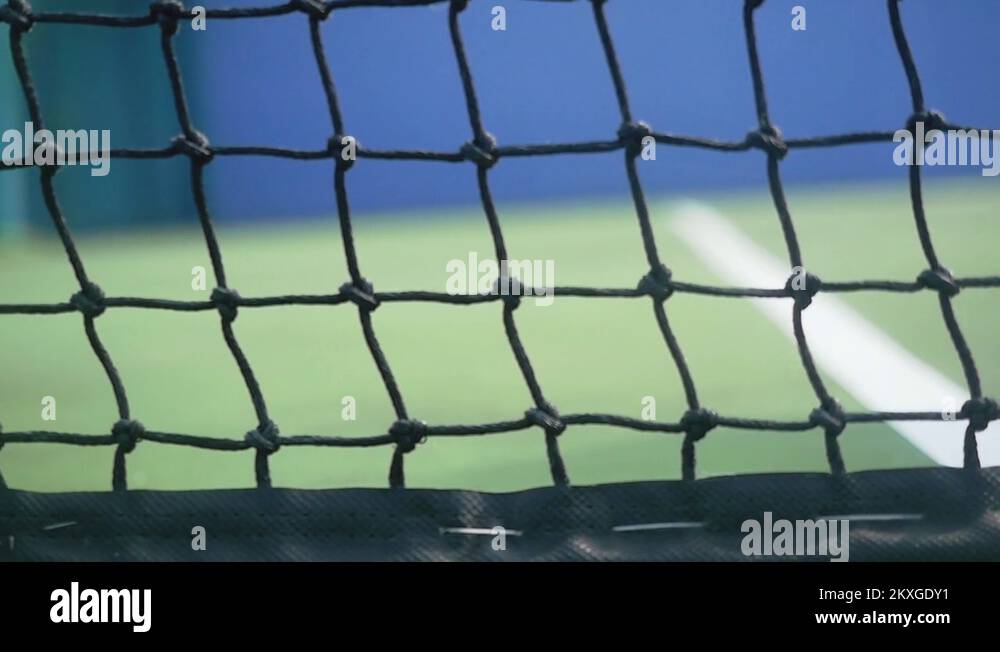 Tennis ball falling on a tennis court hit the grid. slow motion
