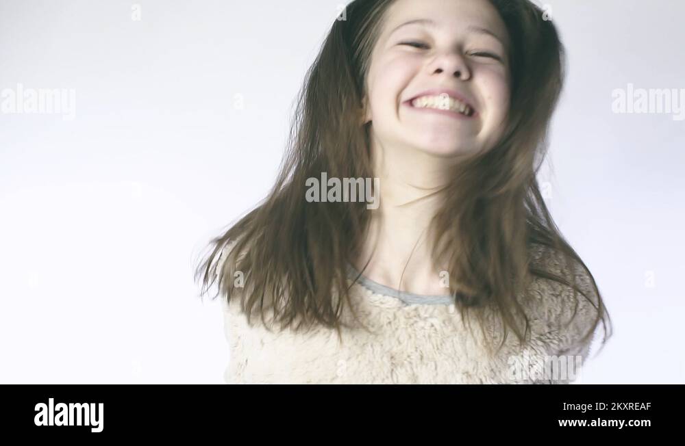 Slow motion beautiful girl jumping on a closeup. Blonde young teenage