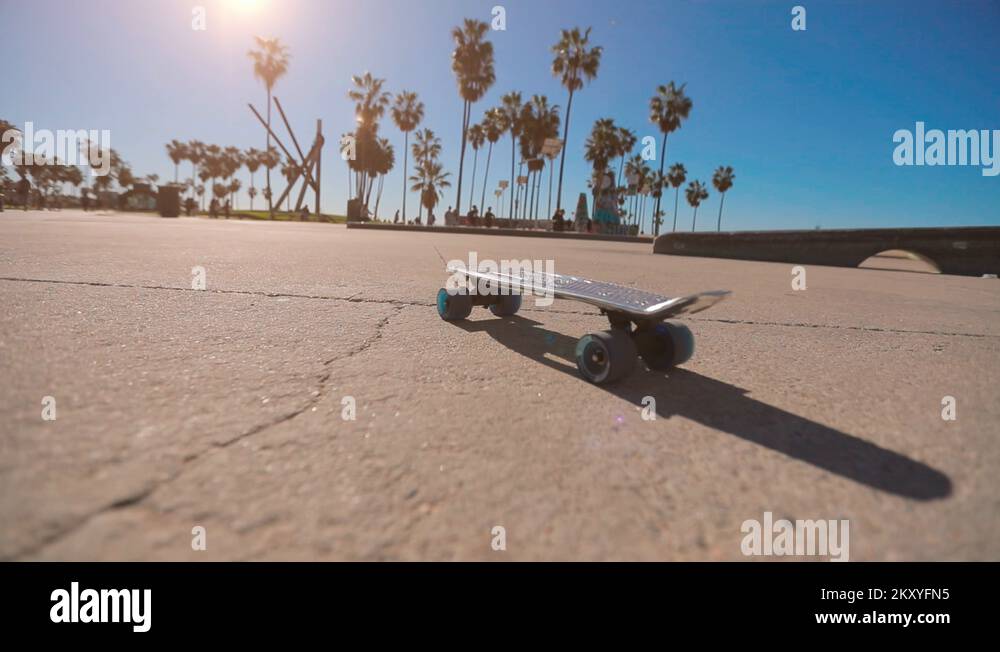 Skateboard with its wheels spinning. Slow motion 4k Stock Video Footage