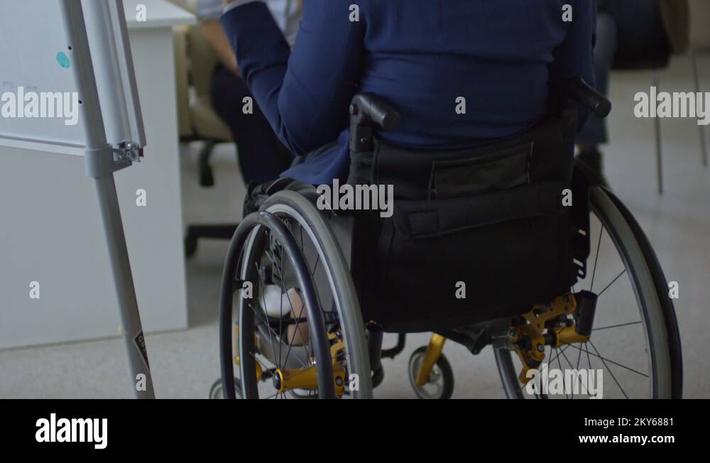 Coach in wheelchair talking to team Stock Videos & Footage HD and 4K