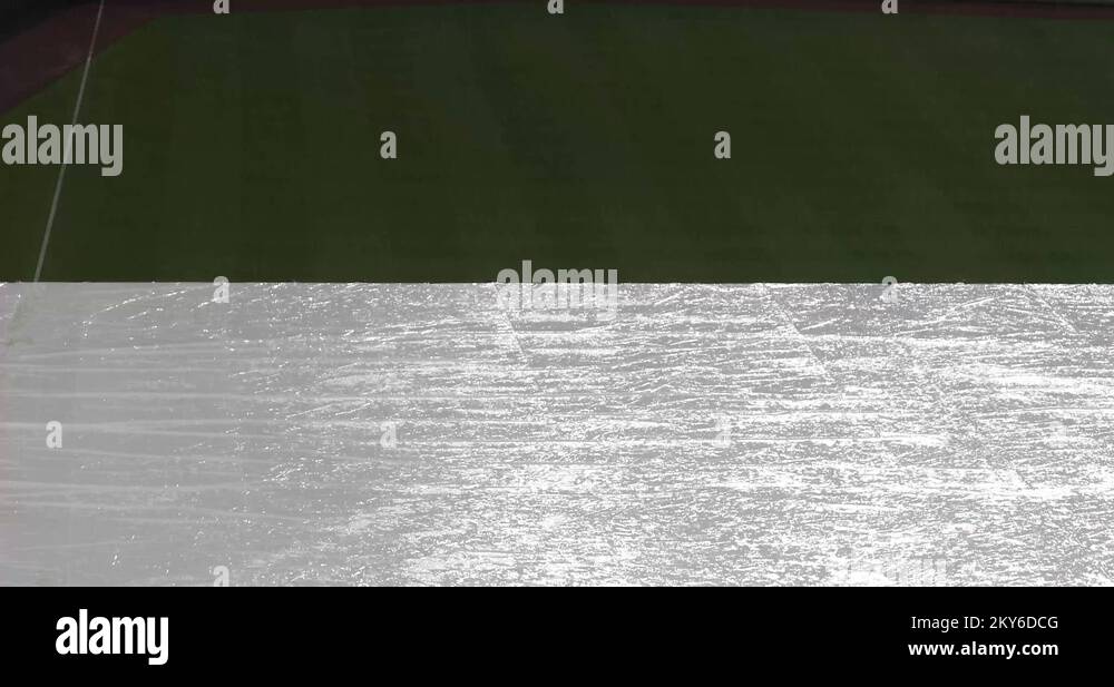 Covering baseball field with tarp Stock Videos & Footage HD and 4K