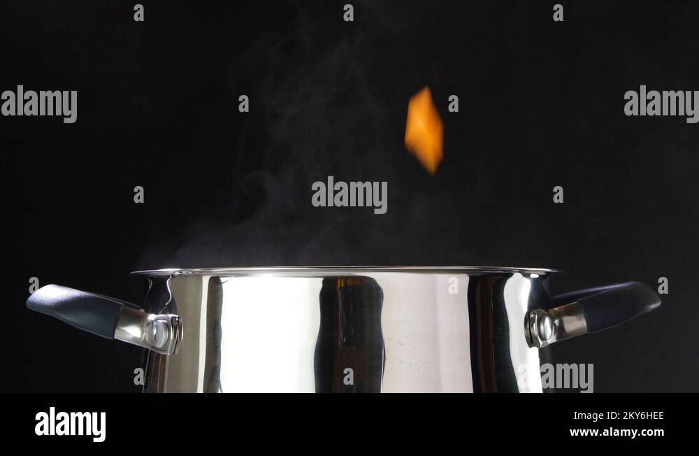 Carrots cooked cooked in a saucepan. Carrot slices into small pieces of