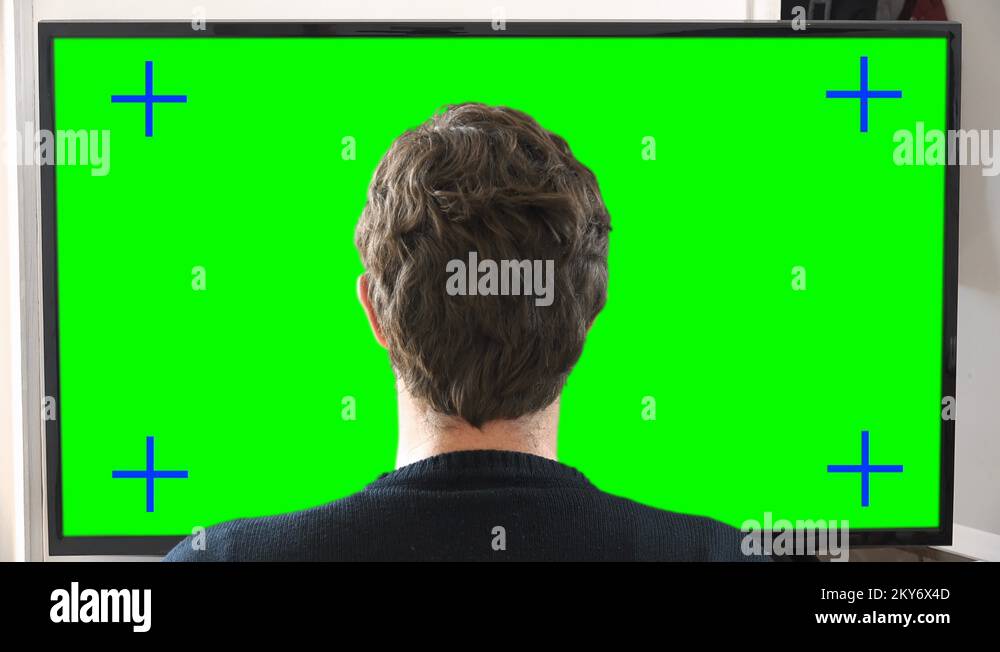 Zoom In Man Watching TV Television Green Screen Stock Video Footage Alamy