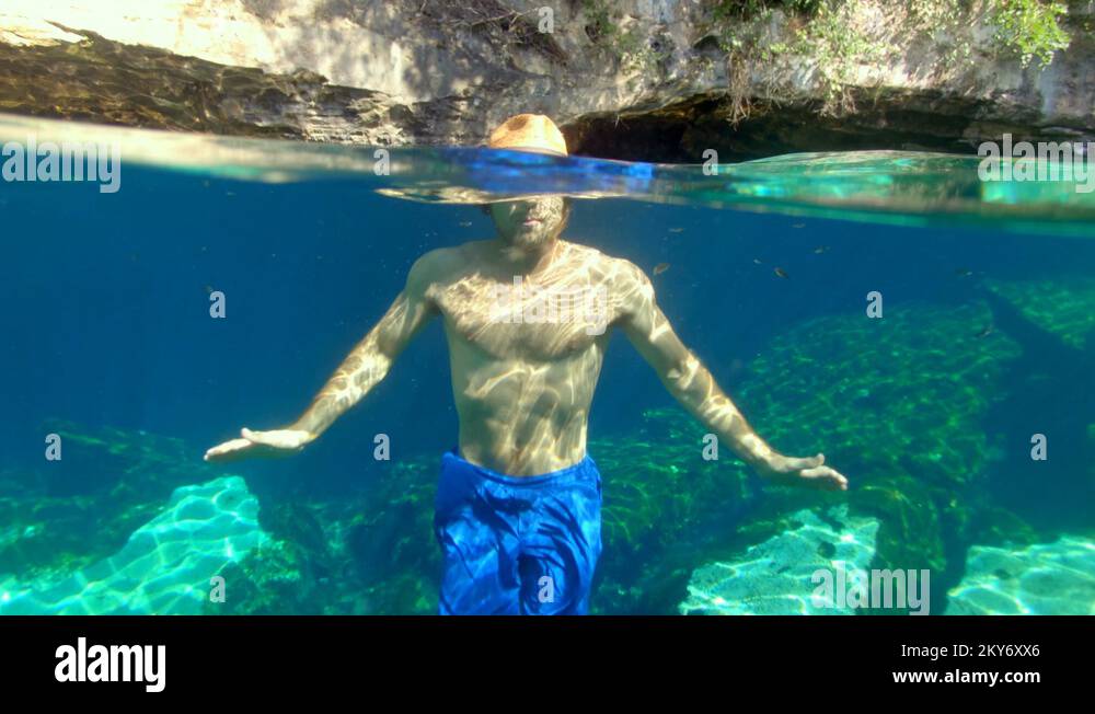 Guy Swimming in a Cenotes in Tulum Stock Video Footage - Alamy