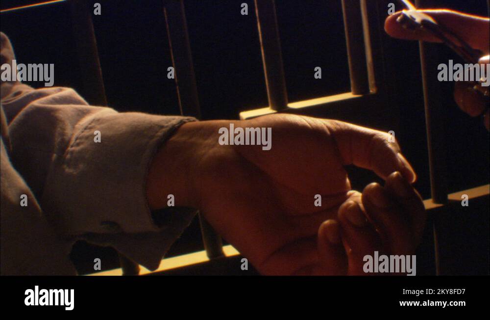 AfricanAmerican arrested with handcuffs, Jail Cell Dark room