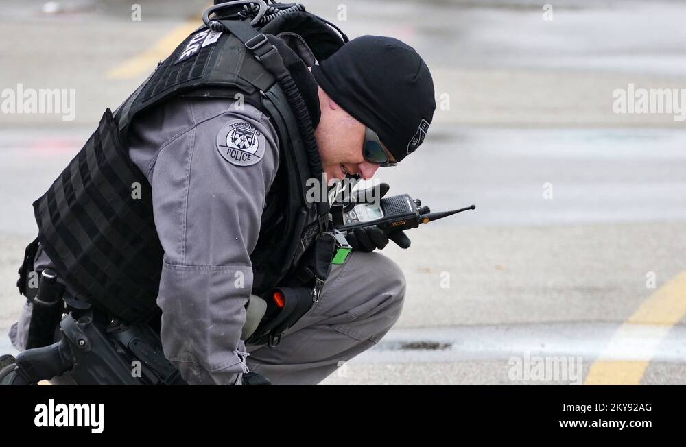 Tactical police office bending over gun on the ground 24fps 1080p