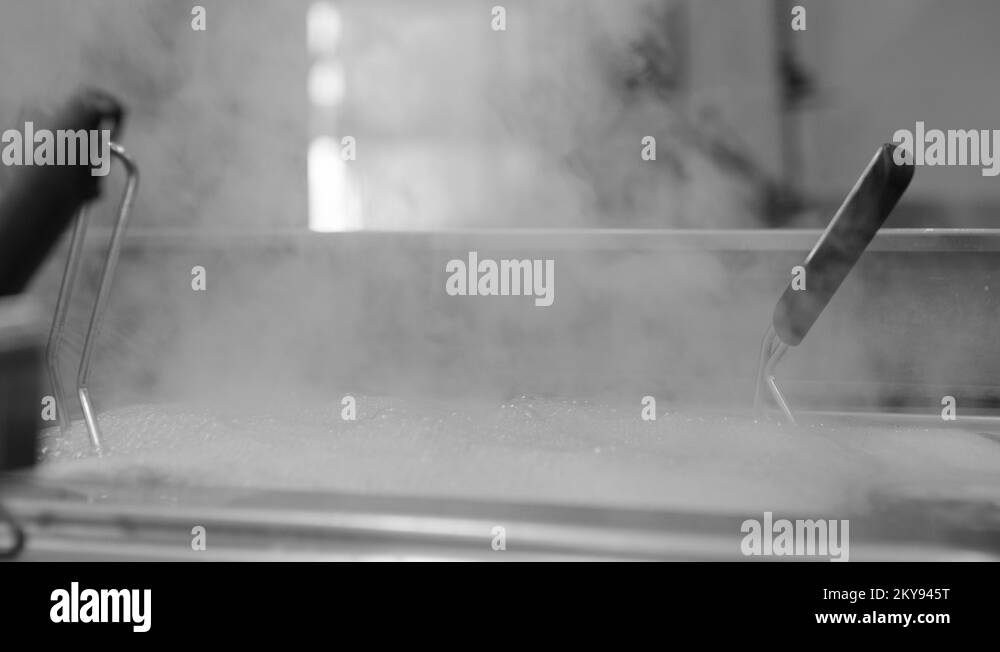 Boiling Oil On Commercial Kitchen In Restaurant, SlowMotion Stock