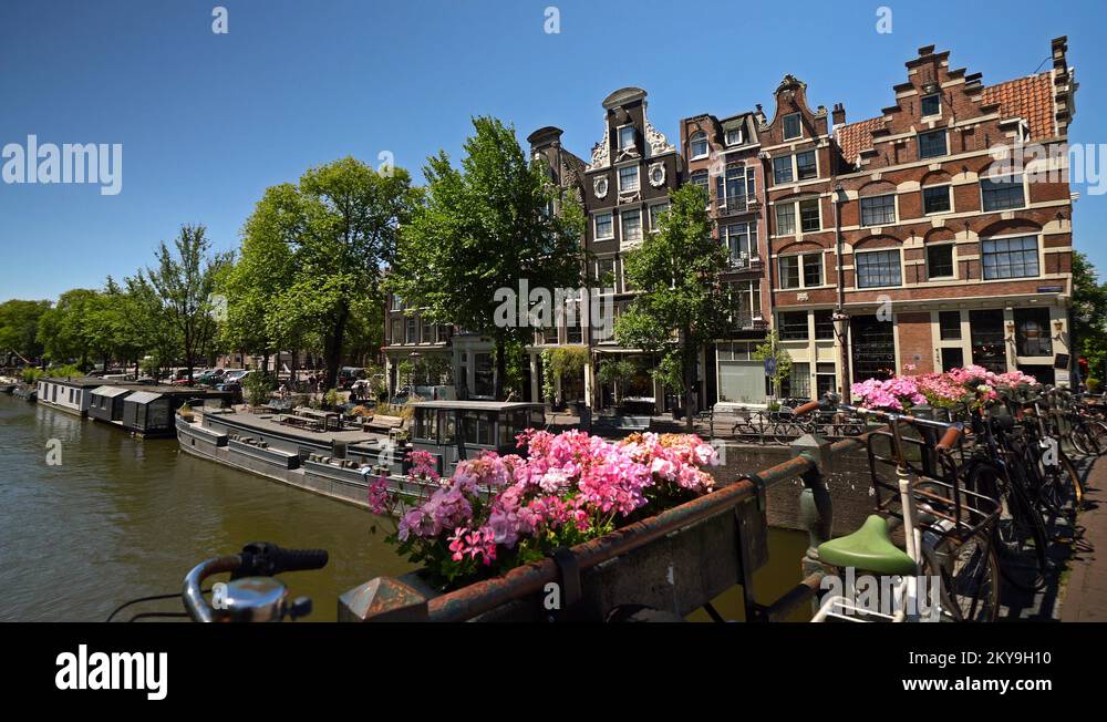 Sloop under bridge with crooked houses | Highlights of Amsterdam Stock ...