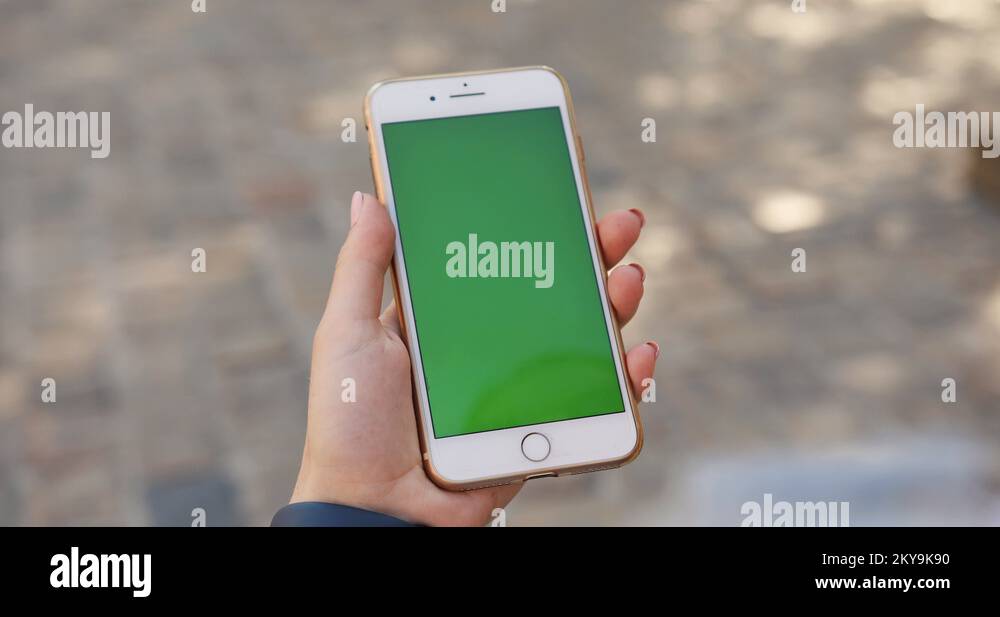 Close up hand woman young holding using smart phone with vertical green ...