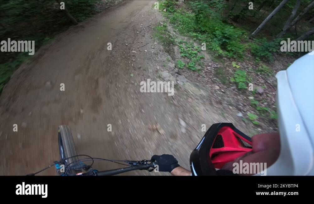 Mountain bike side helmet cam jumping dirt Stock Video Footage Alamy