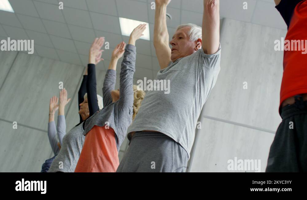 Elderly People Doing Forward Bend Stock Video Footage Alamy