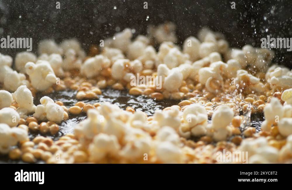 Popcorn popping on heated fry pan. Slow Motion Stock Video Footage Alamy