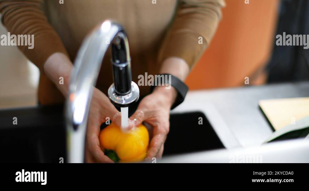 Man washing capsicum under water tap 4k Stock Video Footage Alamy