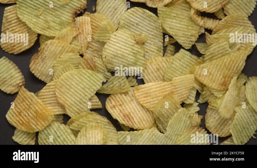 Heap of Crispy Potato Corrugated Chips. Food. Fatty Unhealthy Fast Food Stock Video Footage Alamy