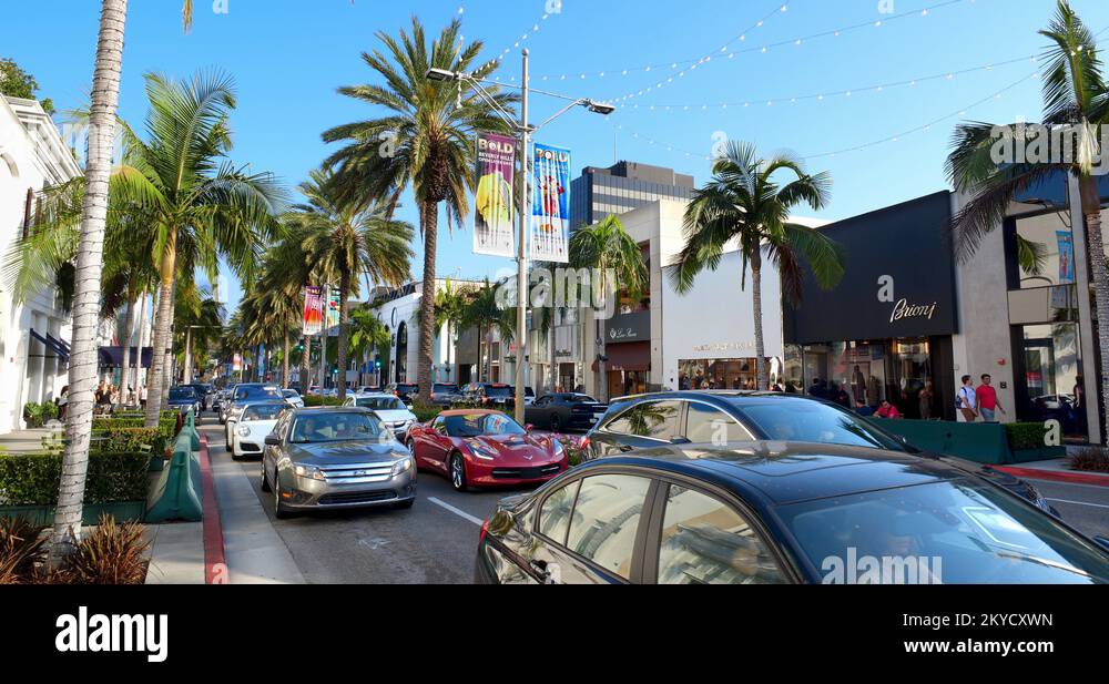 Luxury sports cars driving on Rodeo Drive in Beverly Hills in Los ...