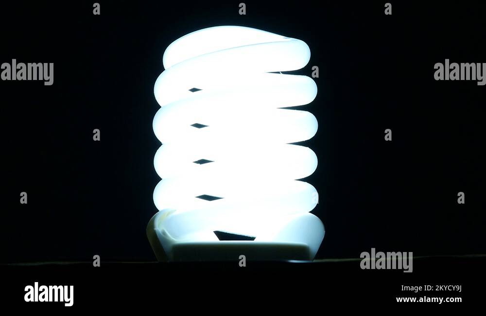 fluorescent lamp turning on and off on black background, slow motion